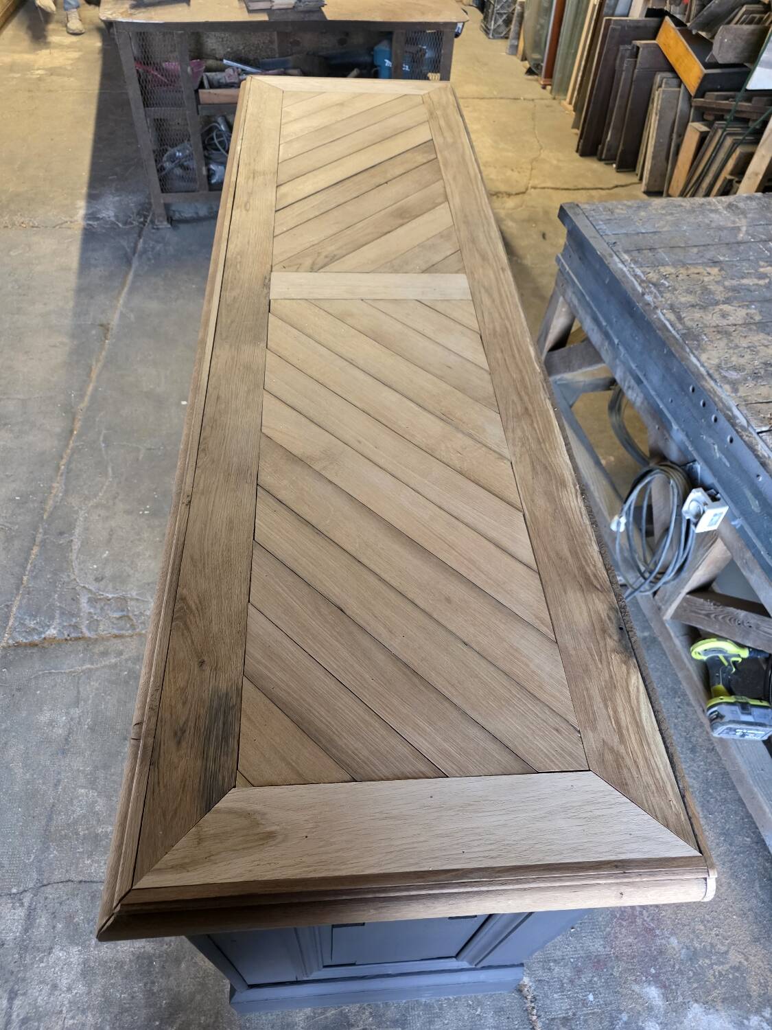 Chevron-patterned oak workbench