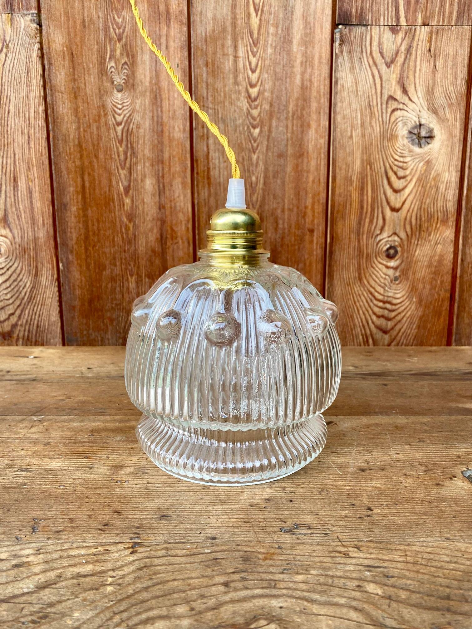 Vintage flower-shaped transparent glass pendant globe.