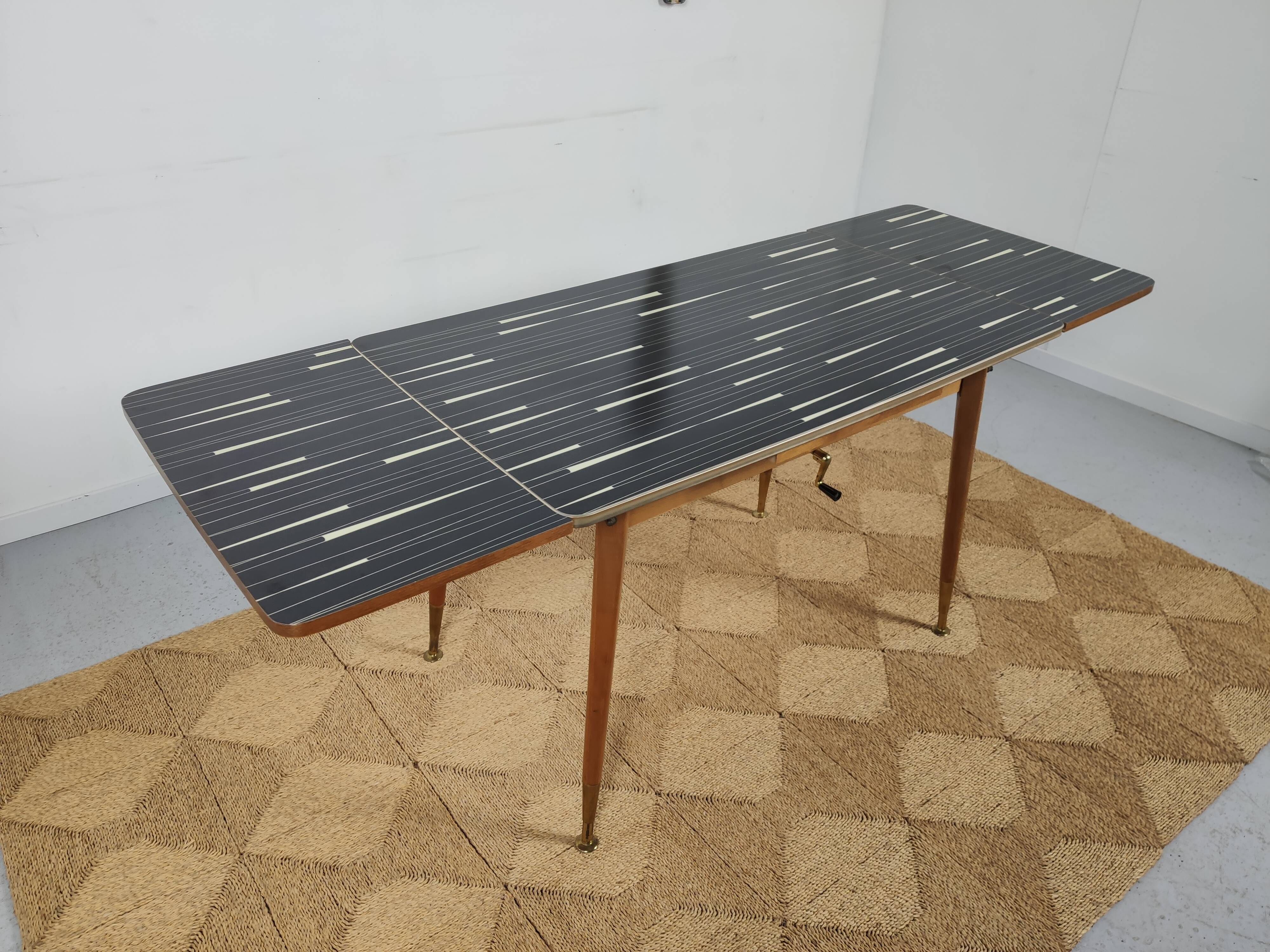 Adjustable vintage table with formica extension cords