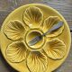Lot of 12 shell-shaped plates, Barbotine, 1950s.