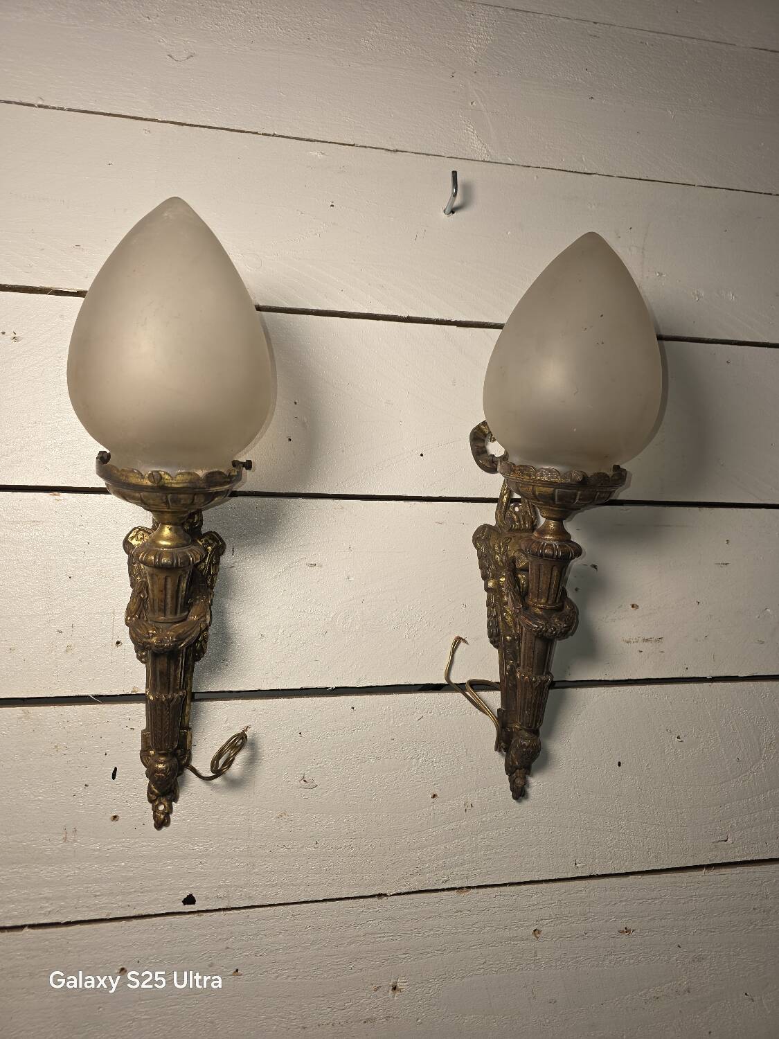 Pair of torch wall lights in Louis XVI style in 19th-century bronze.