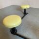 2 black and yellow metal wall coat racks