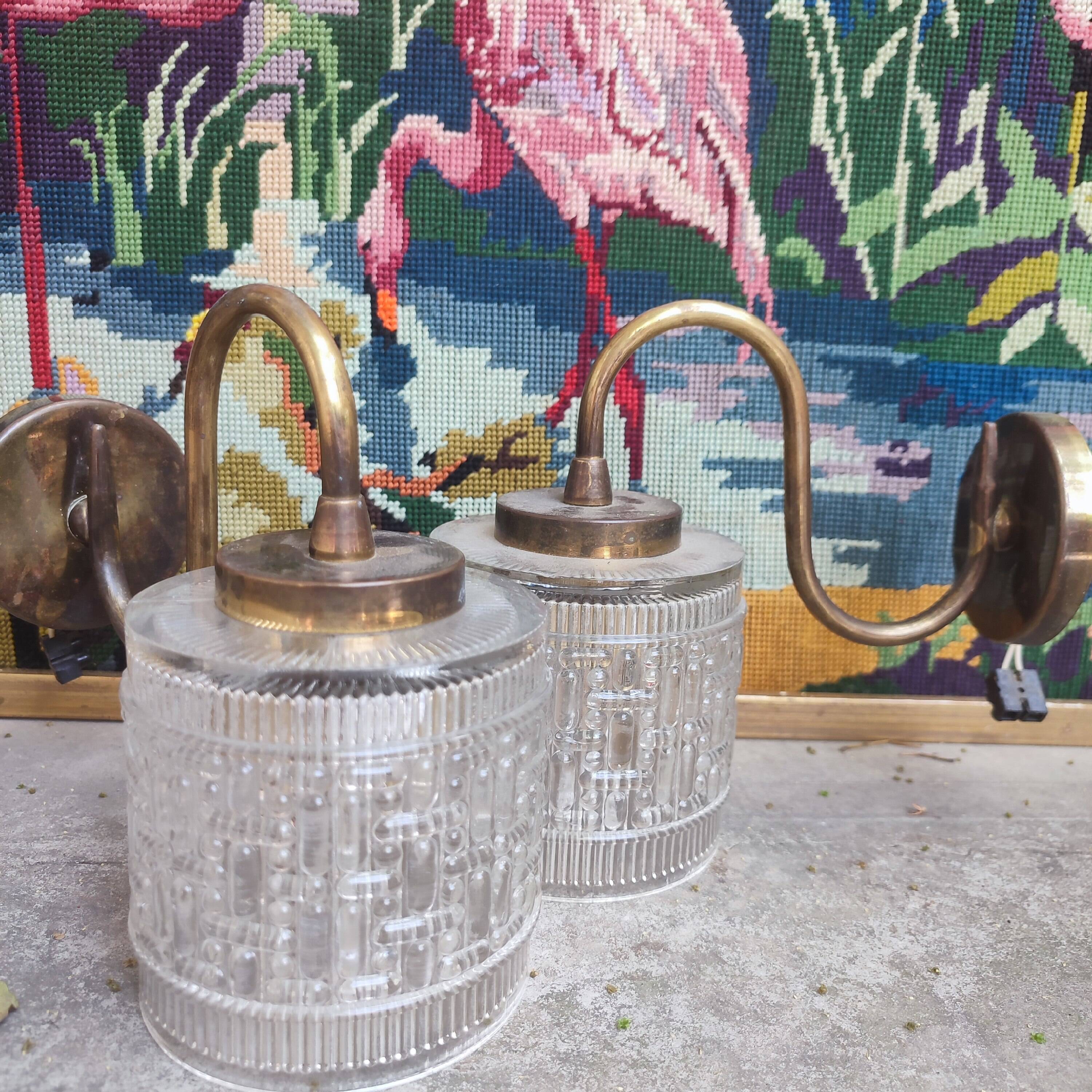 Pair of cylindrical tulip wall lights from the 1950s.