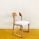 Baumann sled chair – golden oak & off-white fabric