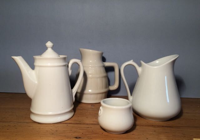 Trio of pitchers and jam jar