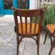 4 bentwood bistro chairs with a pattern on the seat