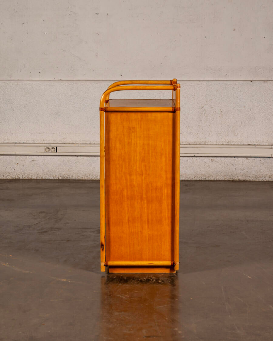 Small storage unit in cane and wood.