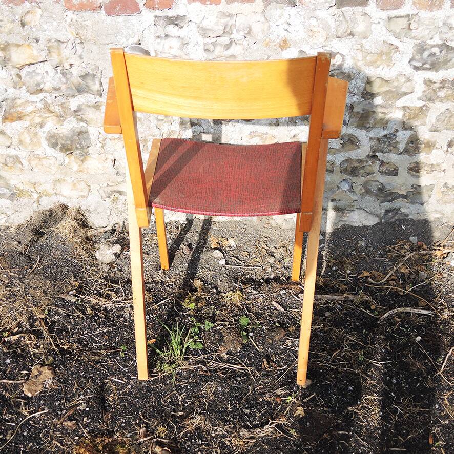 Old wooden and red leatherette bridge chair
