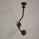 Wooden and metal wall coat rack.