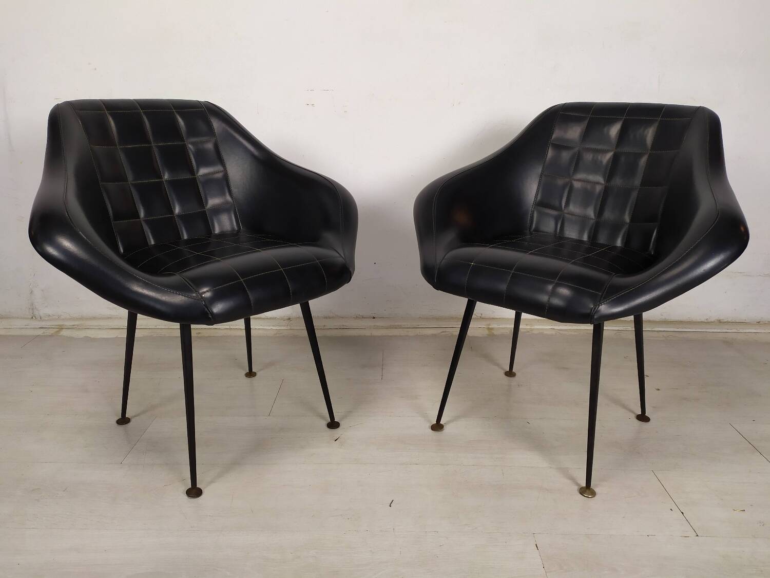 Vintage black skai armchairs