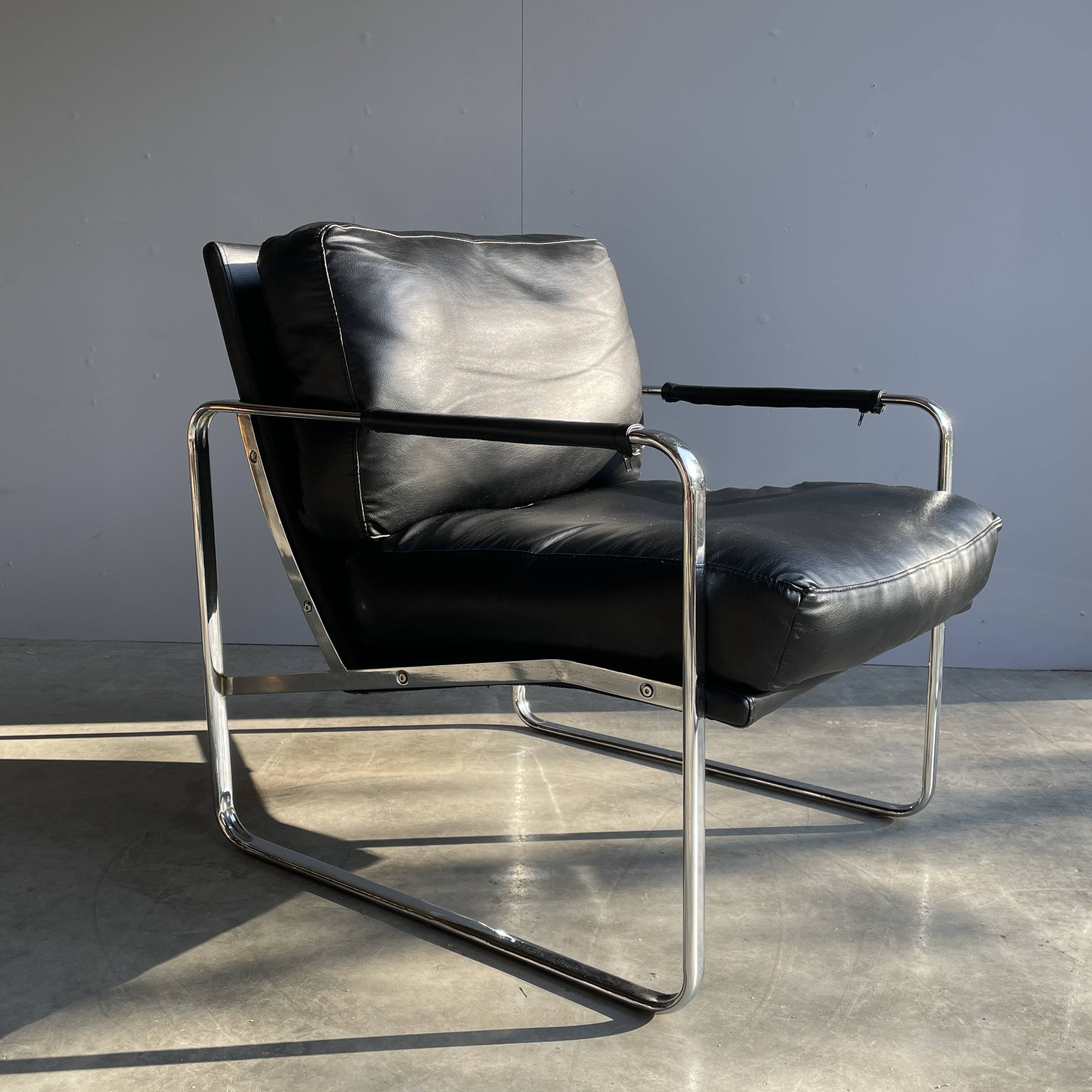 Vintage black leather armchair on metal base, 1980s