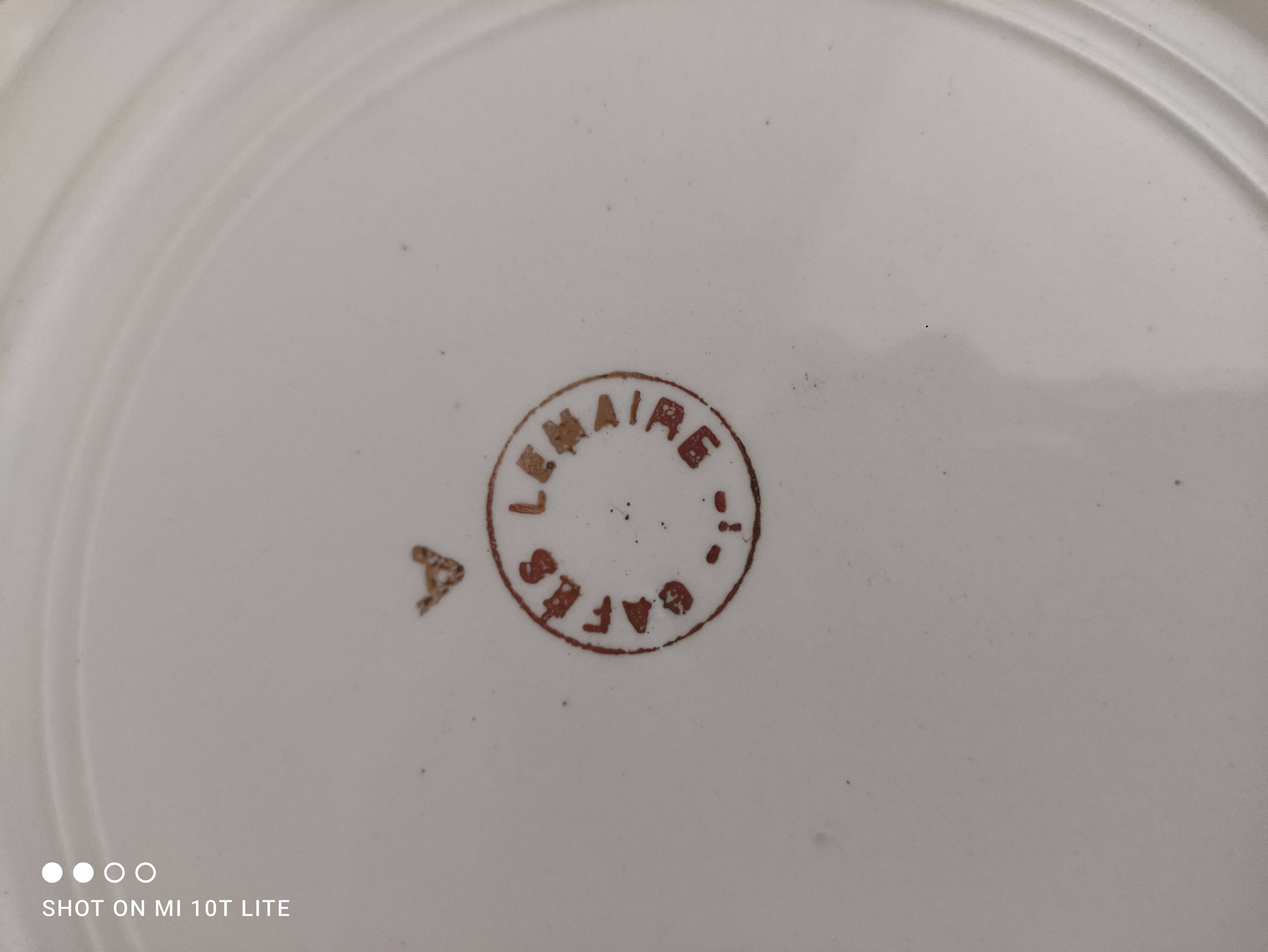 Round hollow plate in water green with a golden frieze, Cafés Lemaire.