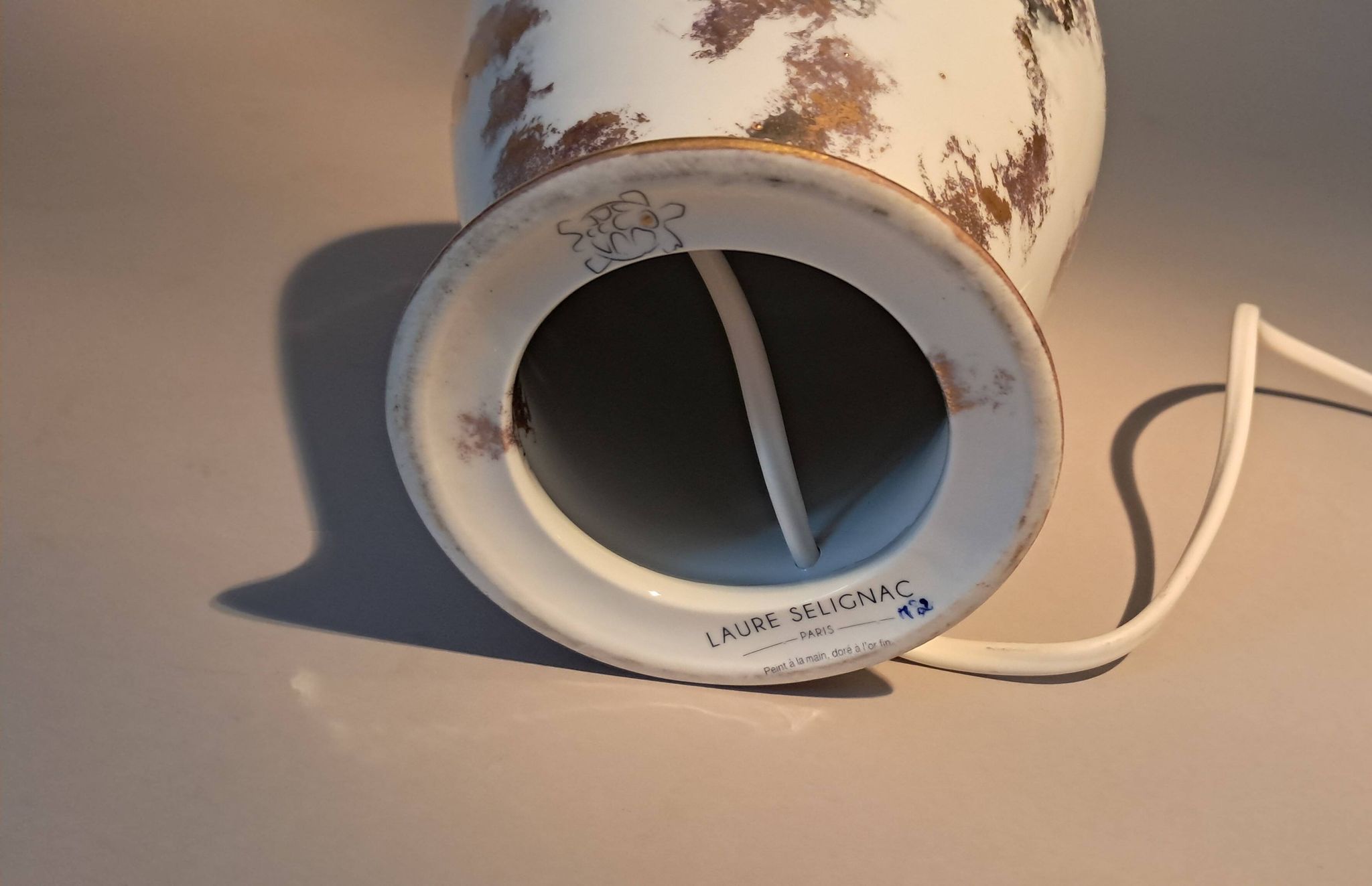 Fine porcelain lamp gilded with gold by Laure Selignac, Paris.
