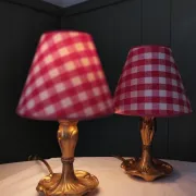 Pair of small lamps in gilded bronze by Petitot and red gingham lampshades.