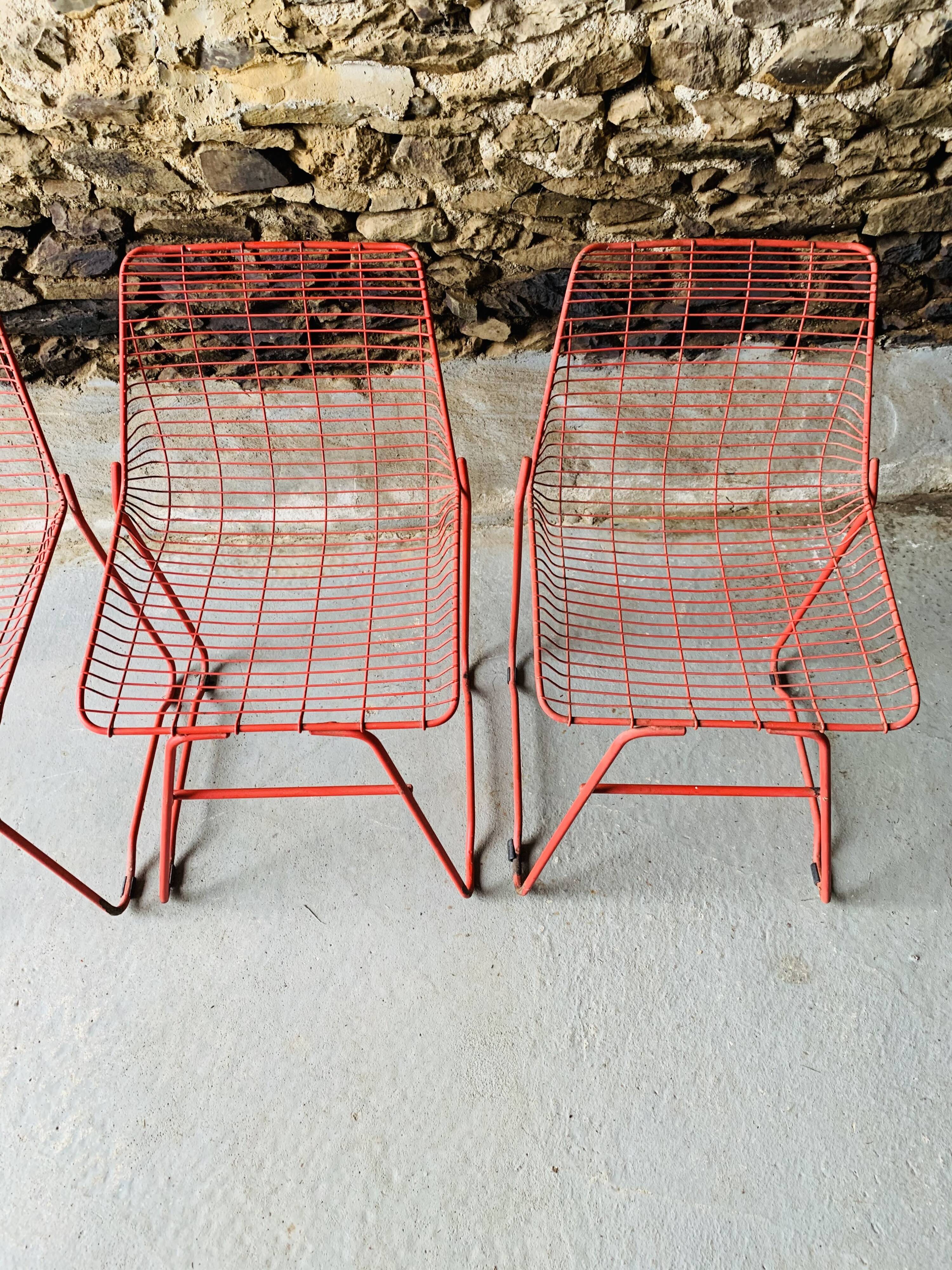 4 red design chairs