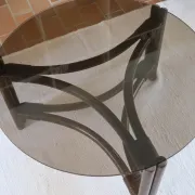 Round coffee table in rattan and smoked glass — 1970s