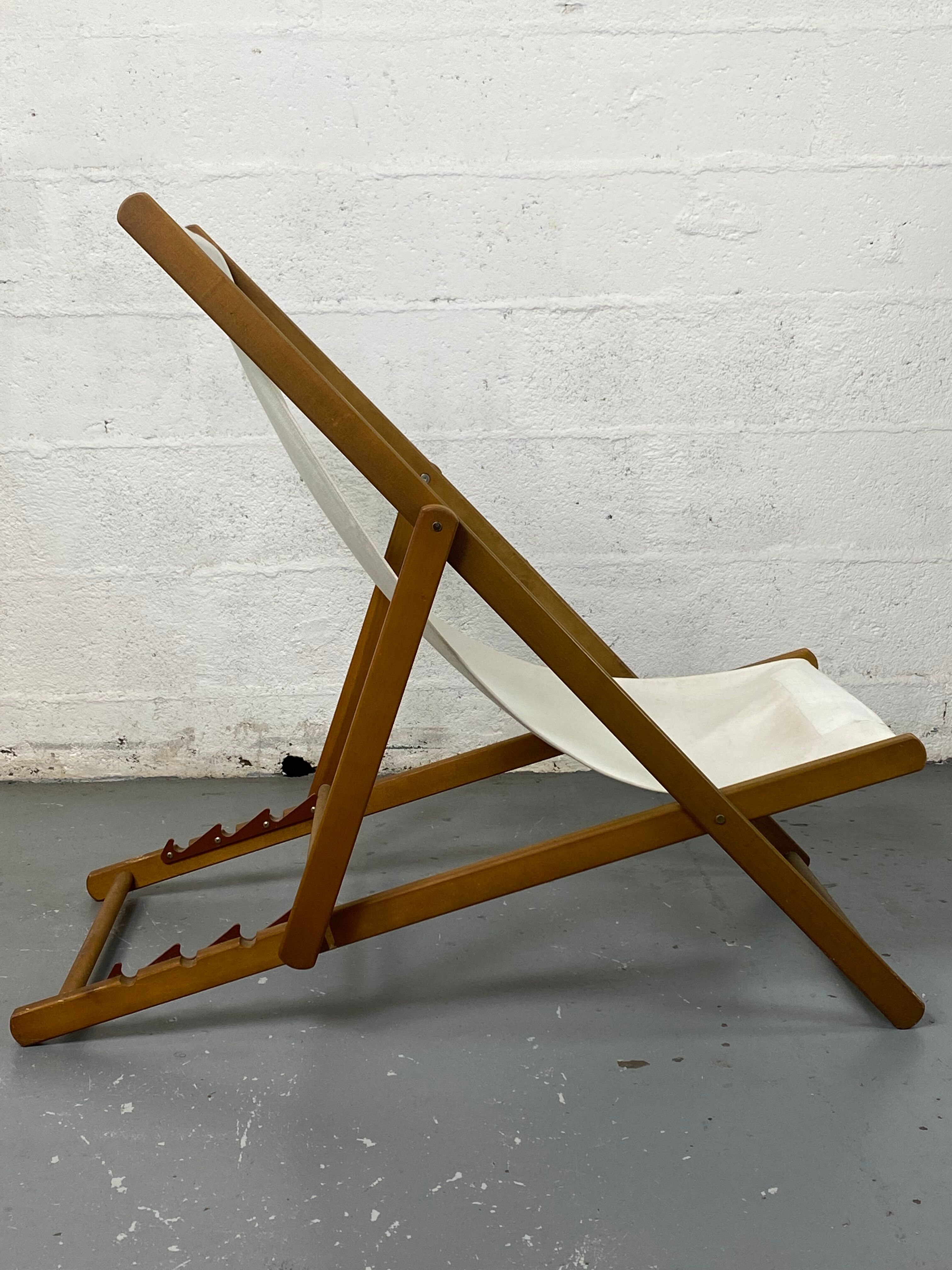 White fabric deckchair with wooden structure
