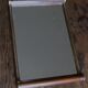Rectangular mirror tray with wooden handles and gilding.