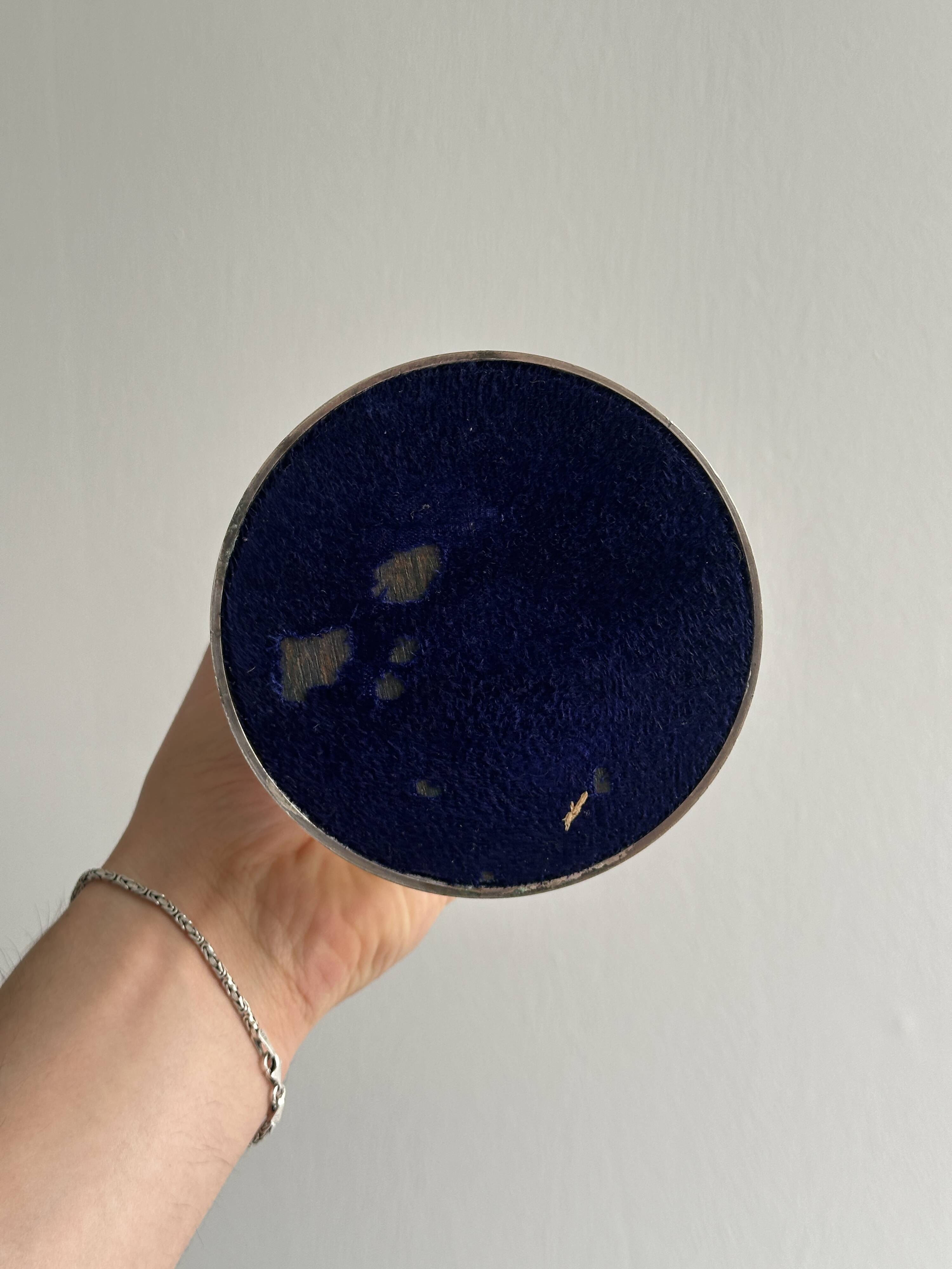 Patinated silver-plated metal candlesticks