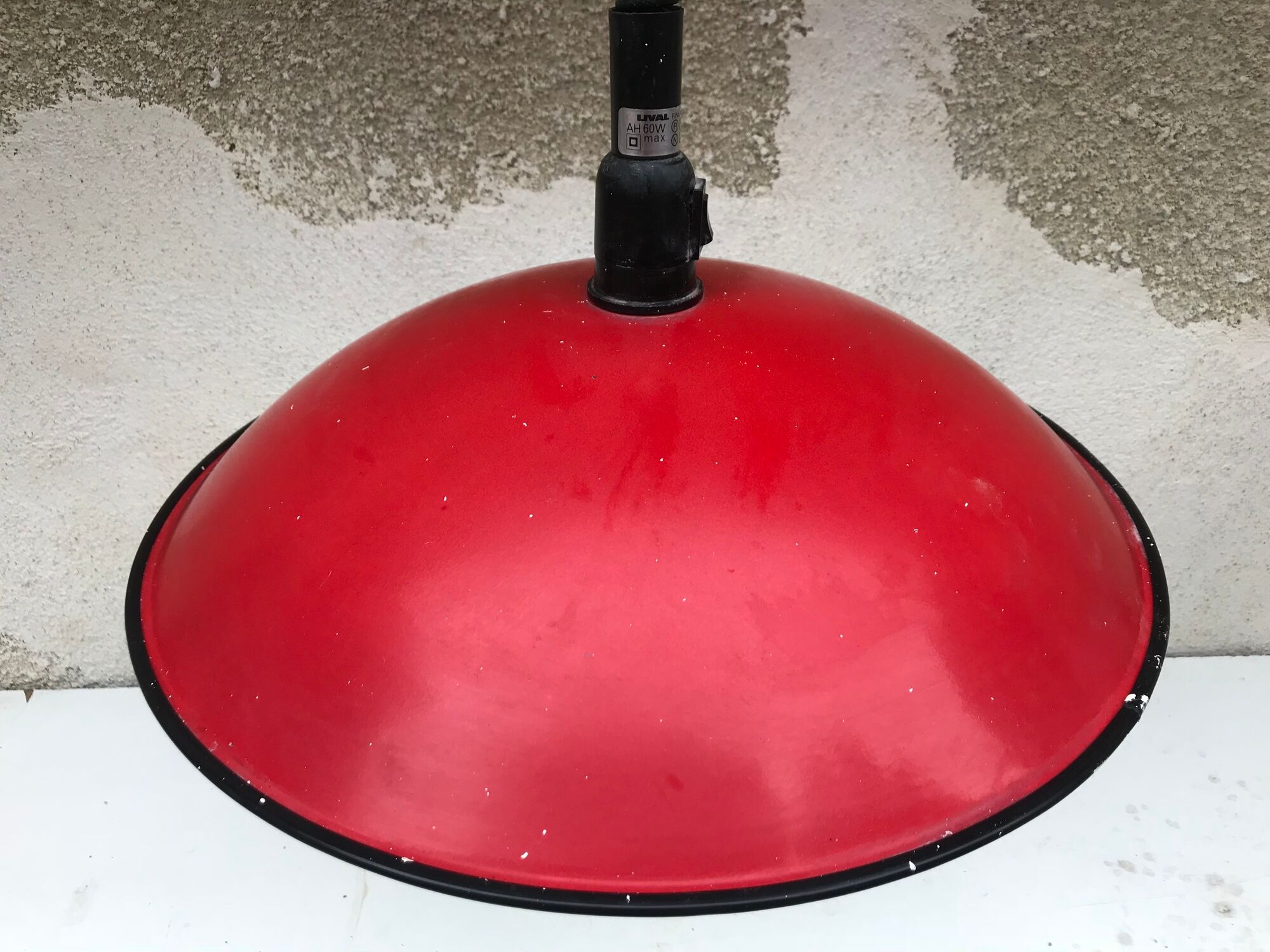 Old red metal suspension lamp from the 70s