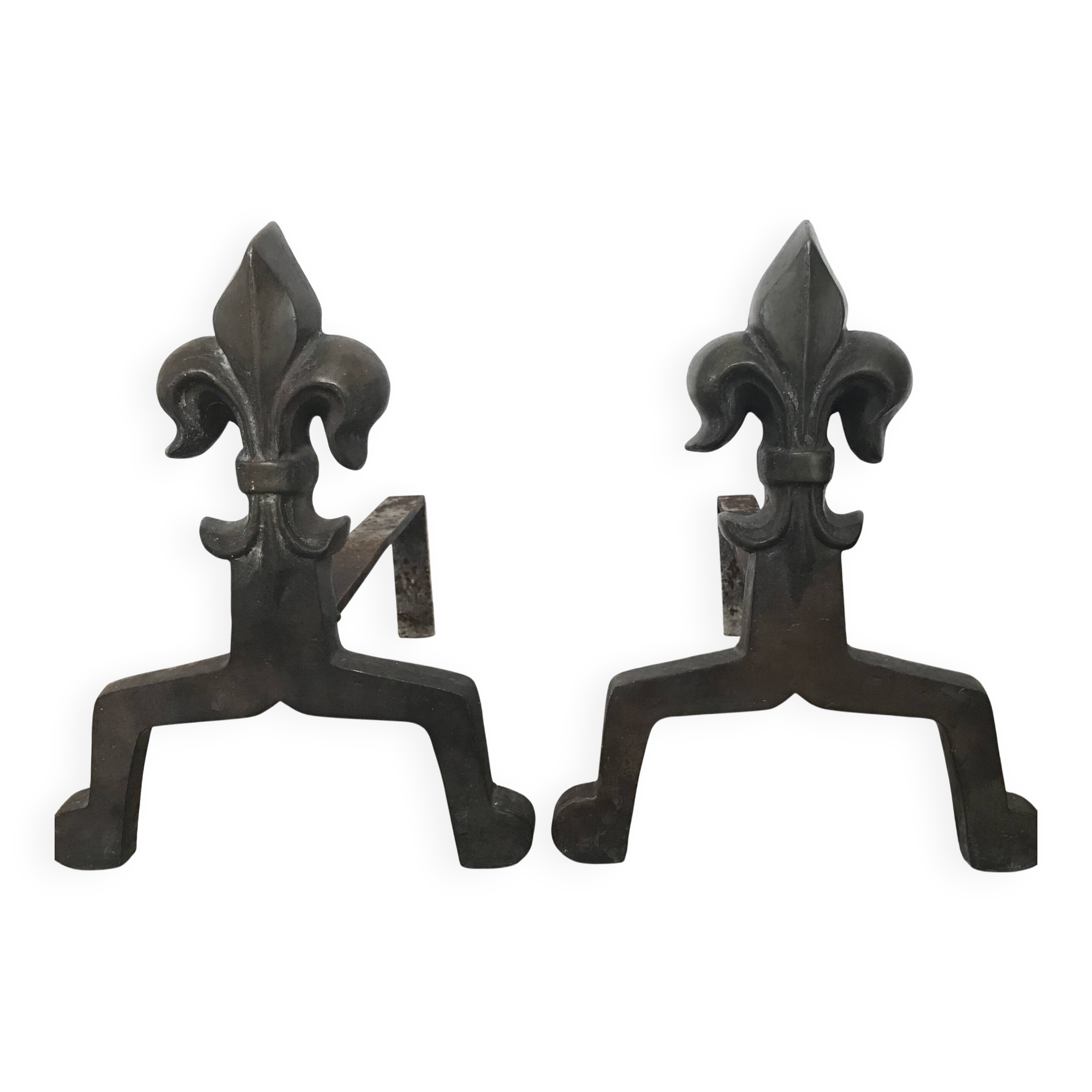 Pair of bronze fireplace firedogs with fleur-de-lys decor, art deco