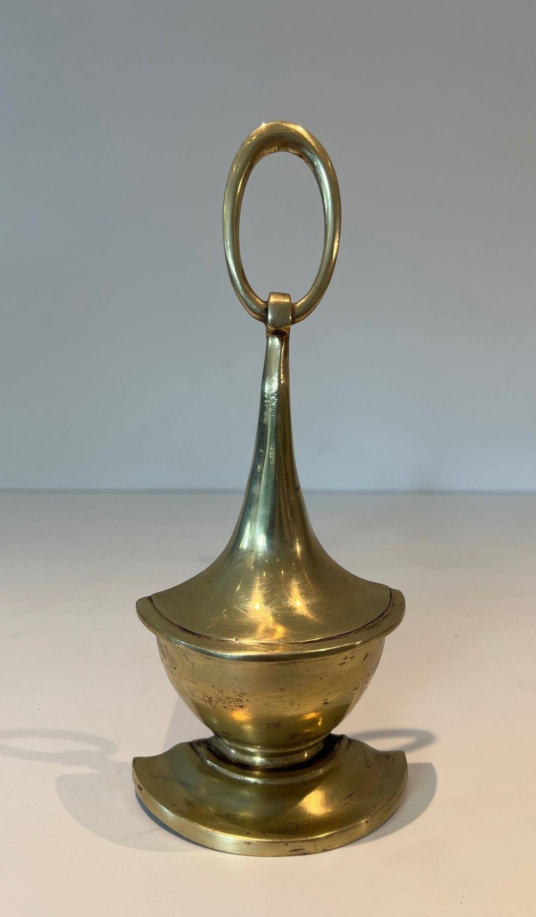 Pair of Bronze Chenets in Neoclassical Style in the Form of an Oil Lamp