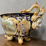 Earthenware planter with polychrome enamelled decoration on a blue background