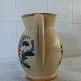 Old pitcher, pot to ance, faience, floral decoration.