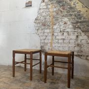 Pair of 20th-century wooden stools with straw seats