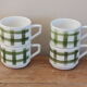 4 vintage cups with green tile decor