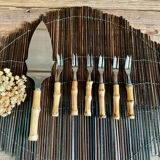 6 bamboo forks and a pie server