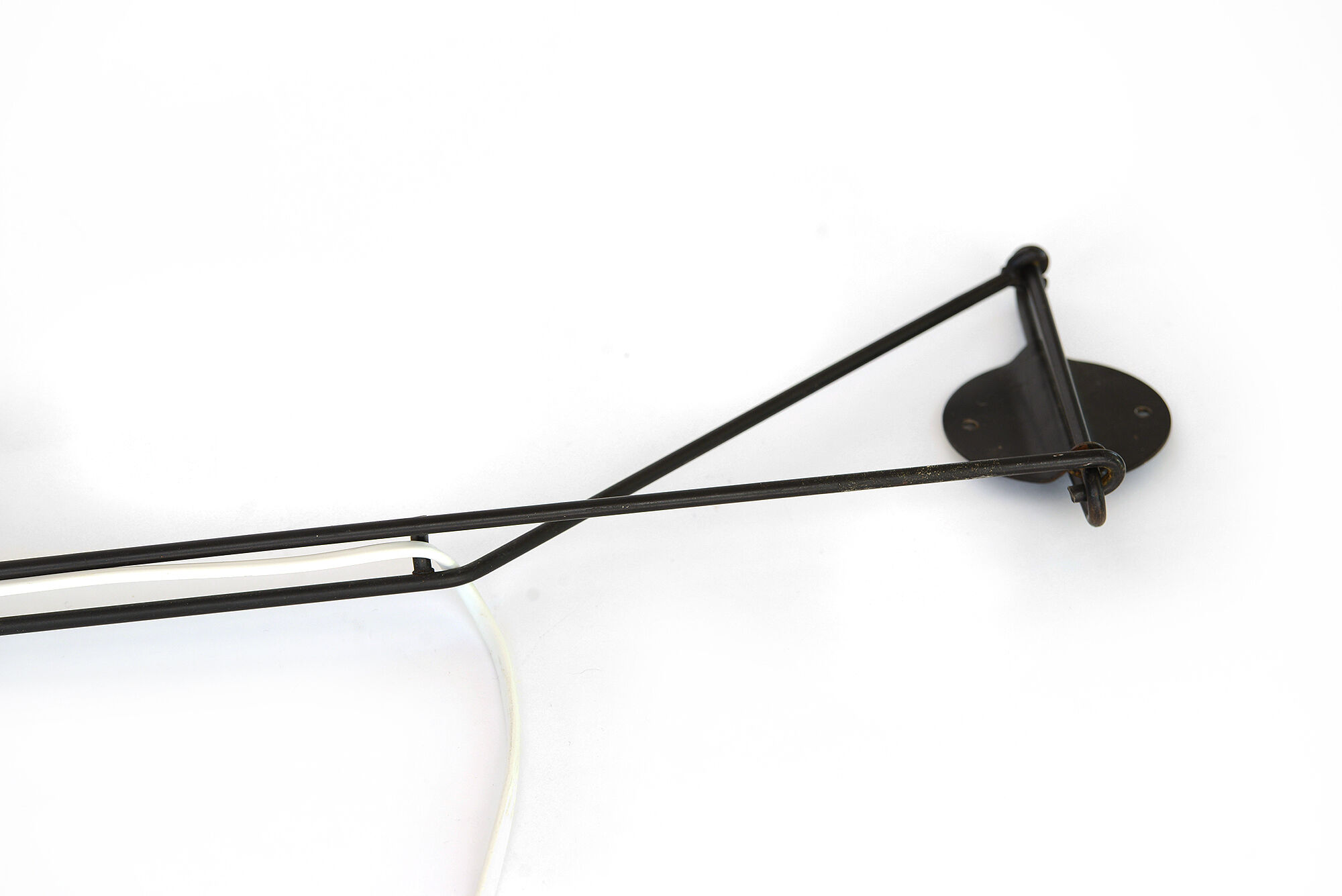 Adjustable "string" type wall light with green original shade.