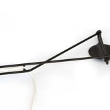 Adjustable "string" type wall light with green original shade.