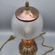 Hollywood Regency bedside lamp in gold metal with a glass globe.