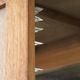 Antique Dutch oak display cabinet with glass shelves and a mirrored back