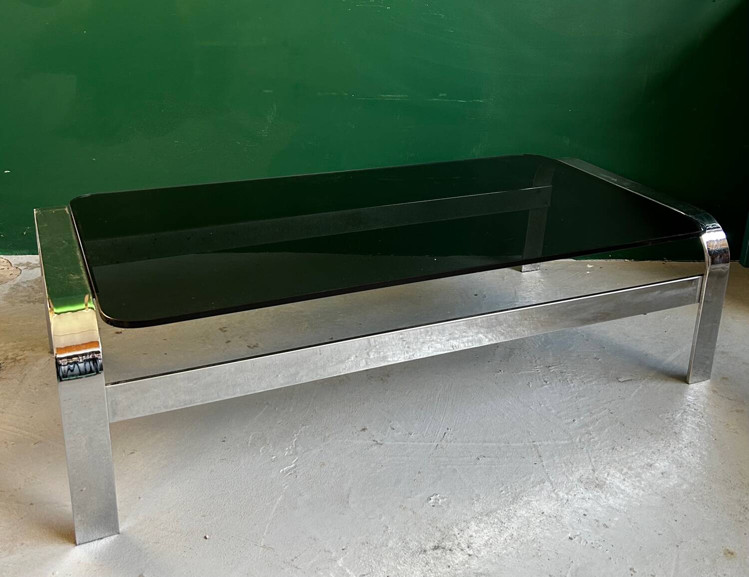 Coffee table in chromed metal and smoked glass