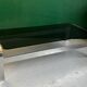 Coffee table in chromed metal and smoked glass