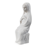 Vintage white plaster statuette of the Virgin Mary.