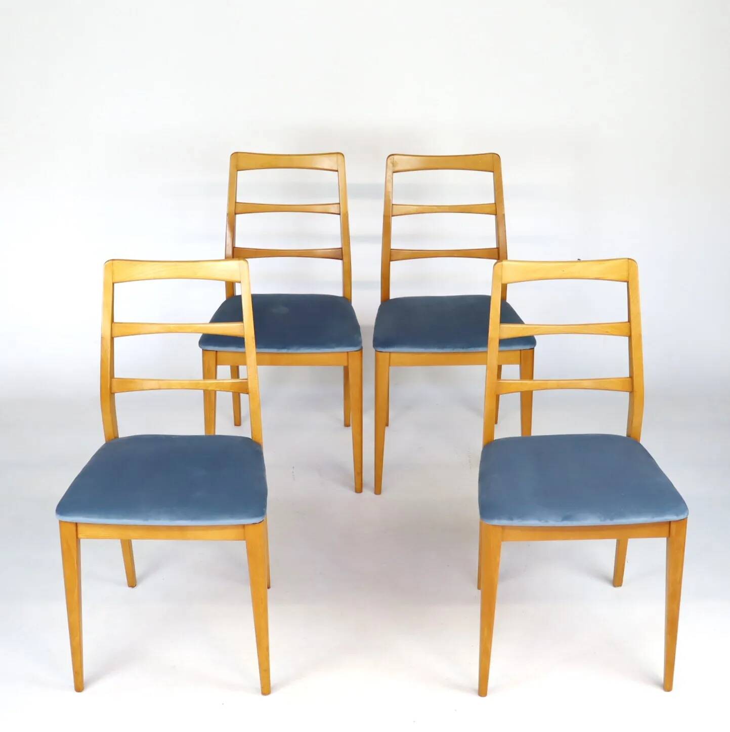 Set of four blue velvet Scandinavian chairs.