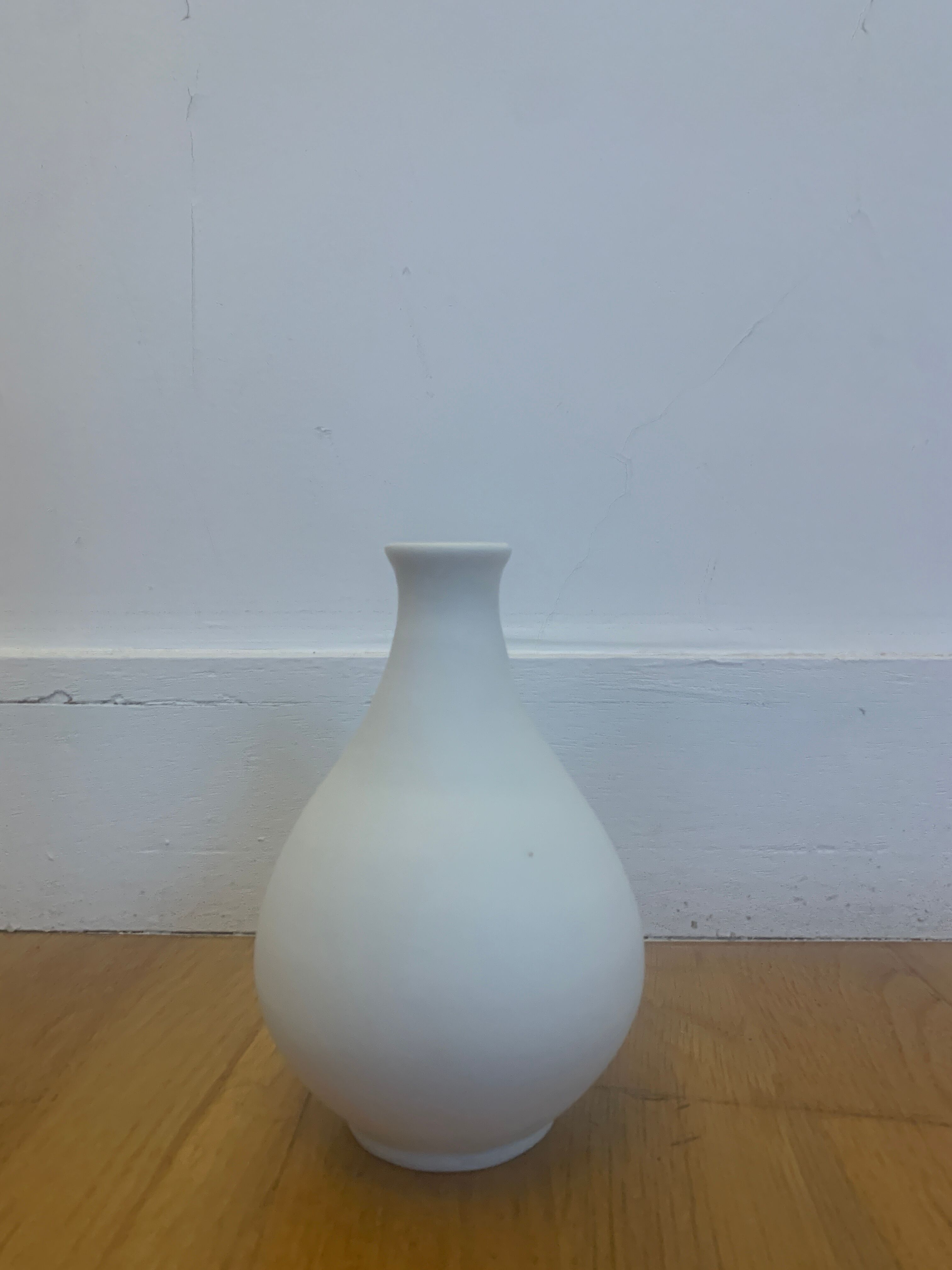 White ceramic with dolphin motif