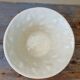 Important white earthenware pot cache with leafy decoration