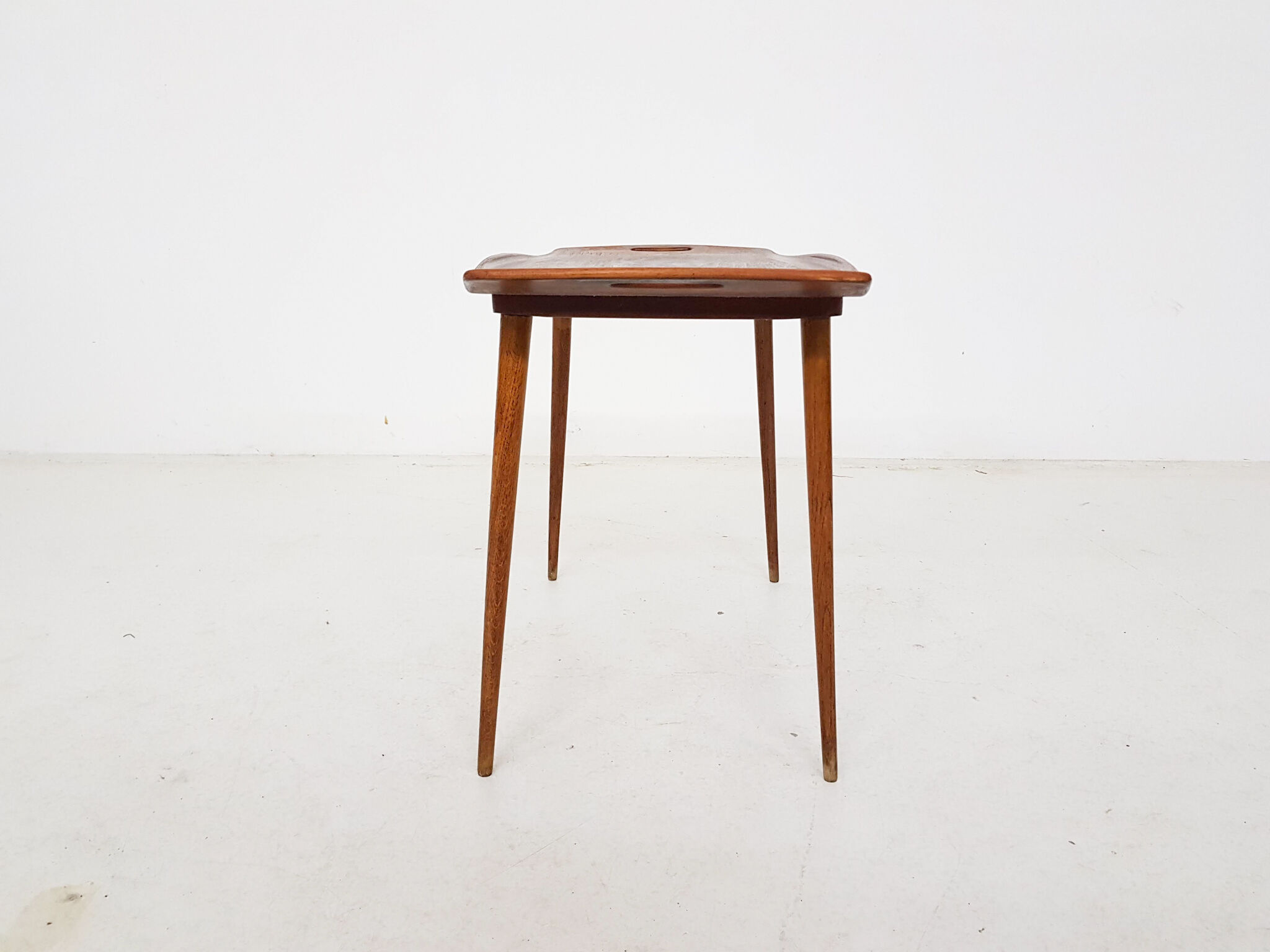Teak side table with handles by Jens Quistgaard