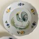 Pair of plates with naive Eastern rooster decoration