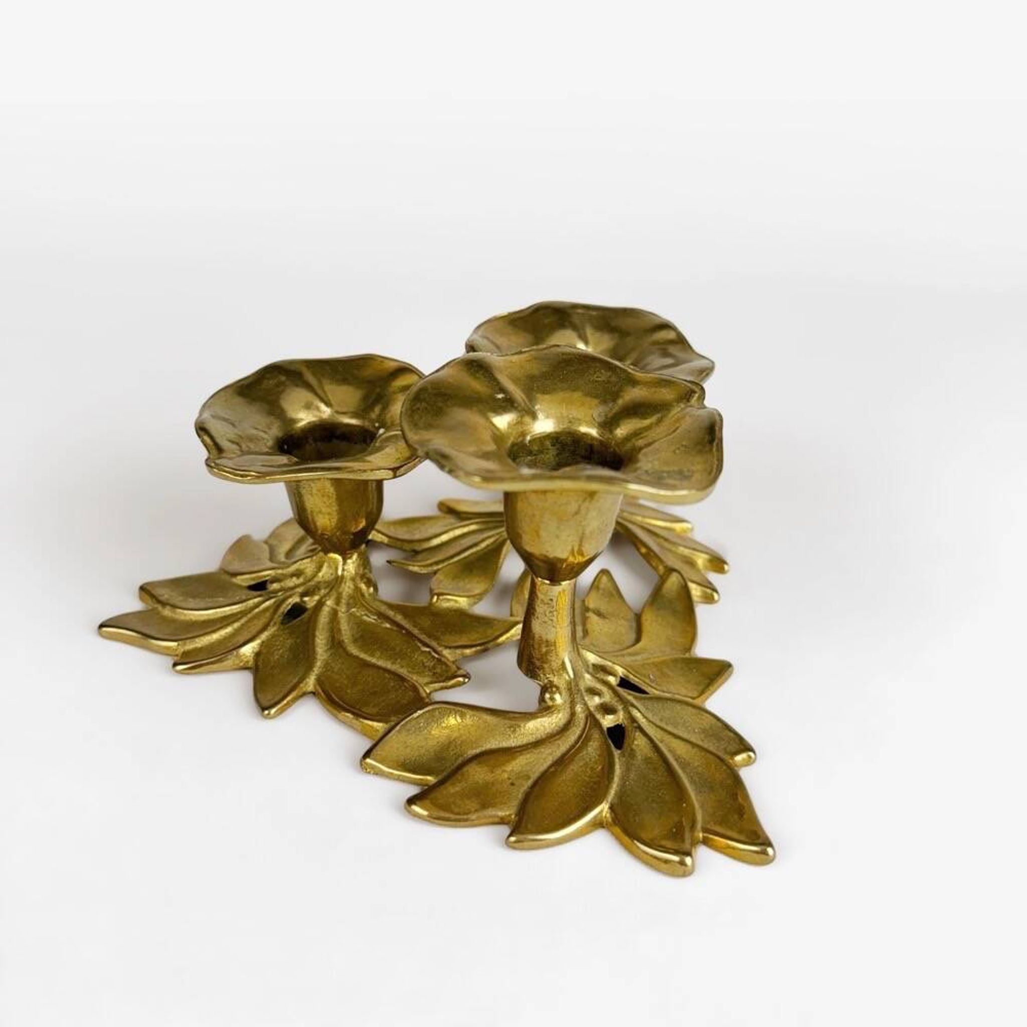 Art Nouveau style three-flower brass candle holder