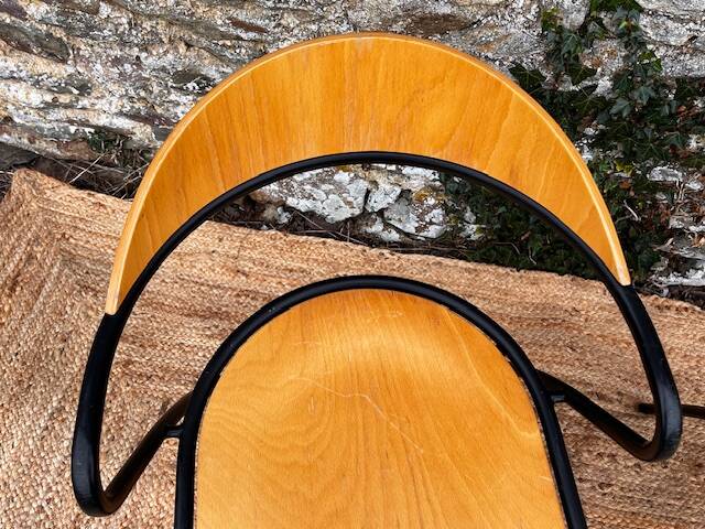 Pair of wooden and black metal chairs