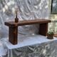 Brutalist wooden bench made of solid oak beam.