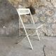 Vintage perforated metal folding chair