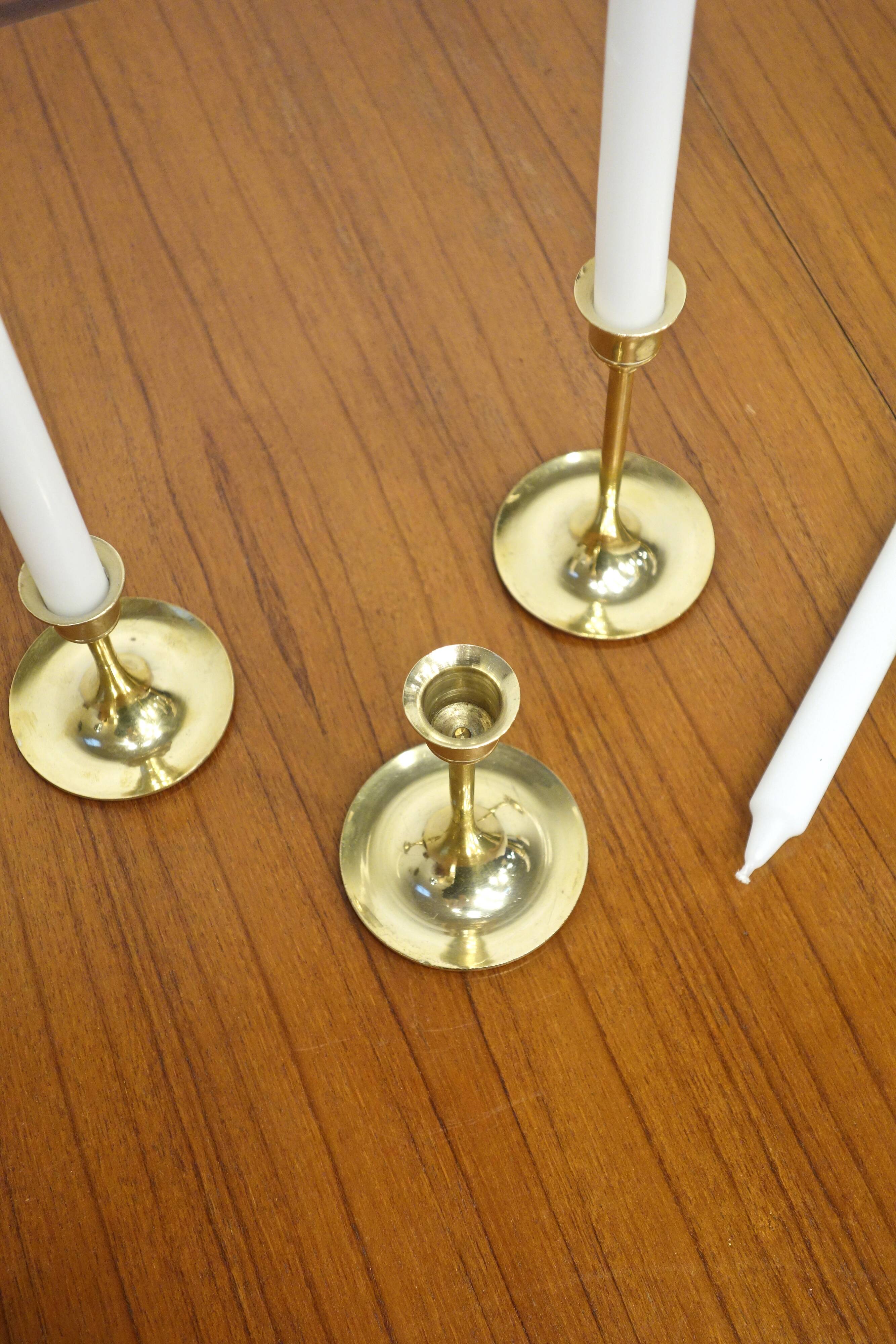 Set of 7 Scandinavian brass candle holders, 1960's