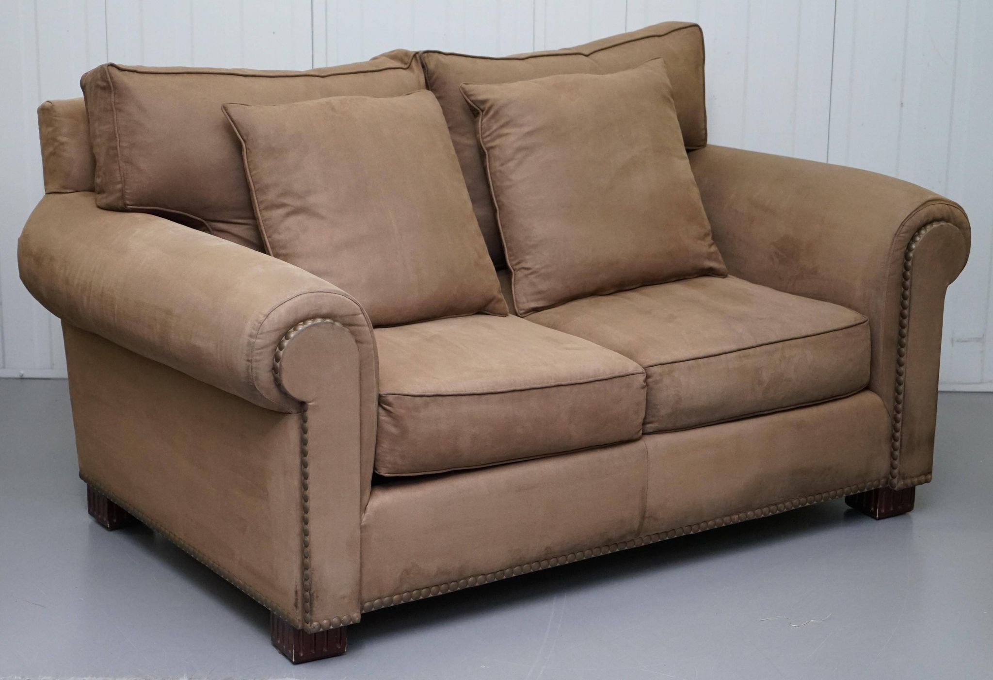 Ralph Lauren Jamaica velvet sofa pair with feather cushions.
