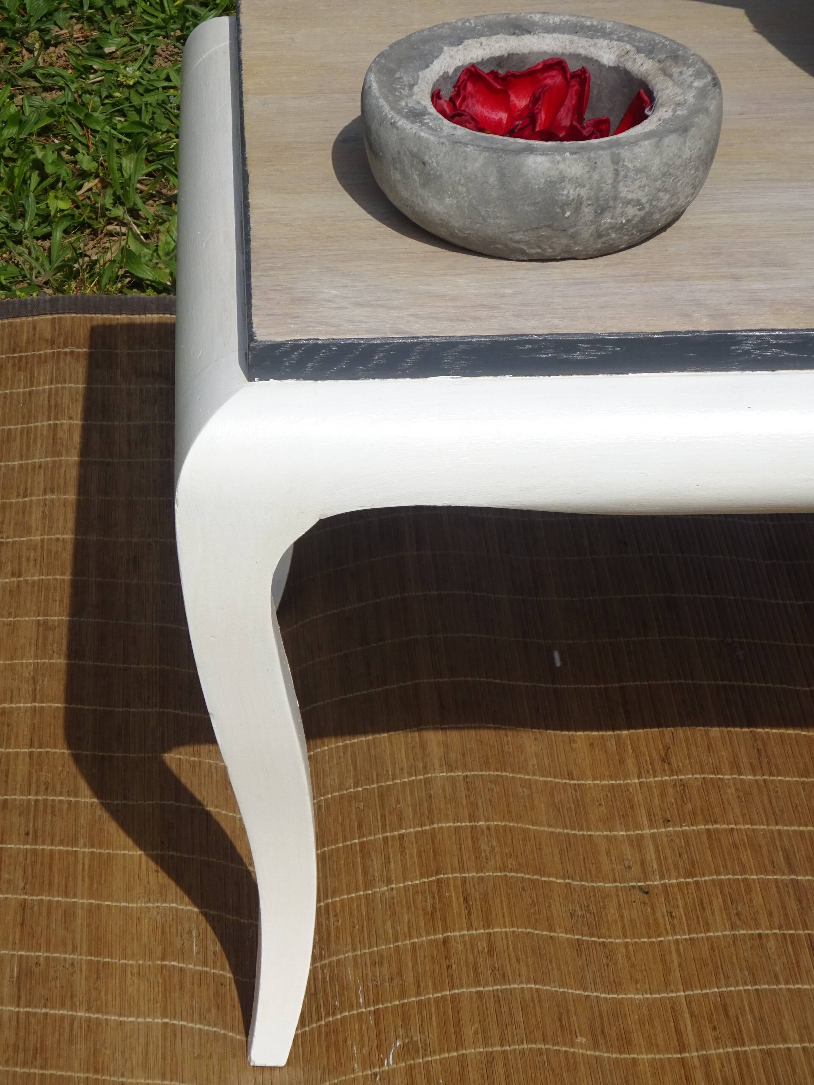Oak coffee table with curved legs.